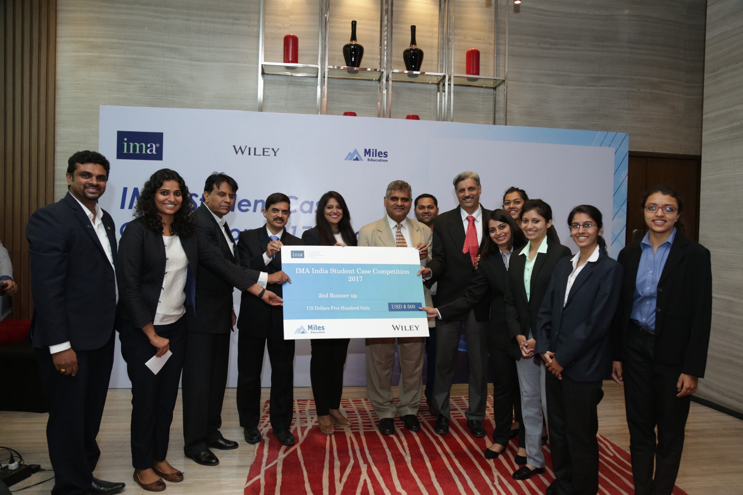 Learning management accounting through real-life case studies. The team from Pune Symbiosis College of Arts and Commerce receive their award surrounded by the panel of judges and representatives from IMA, Wiley, and Miles. (PRNewsFoto/IMA)