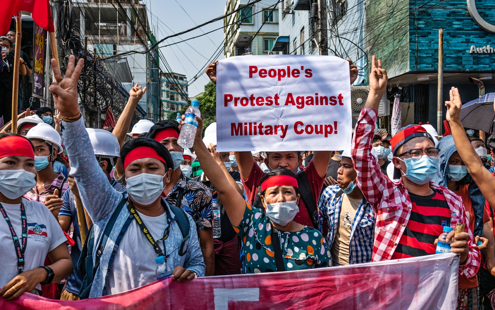 Photo Credit: Para peserta aksi demo tolak kudeta militer di Myanmar. GETTY IMAGES